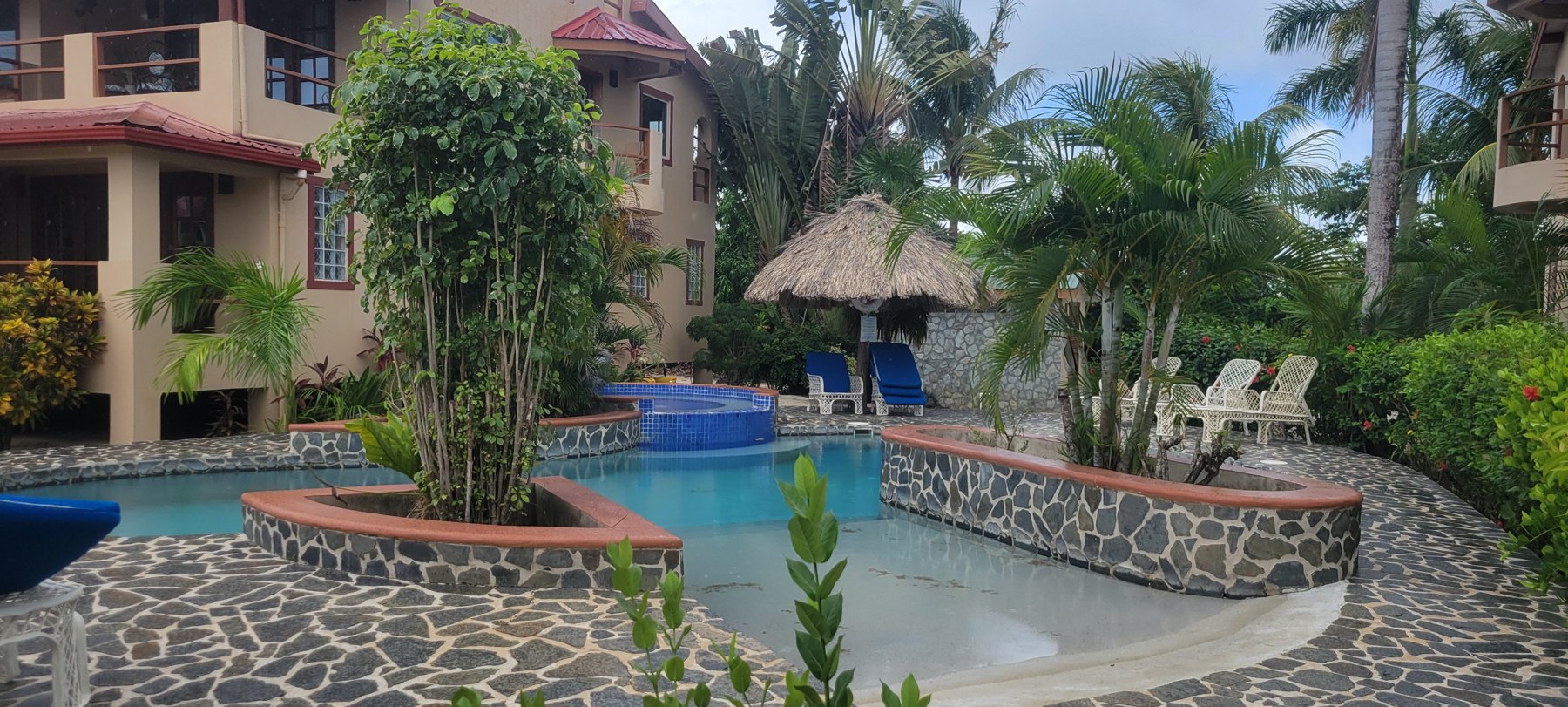 Community pool set in tropical gardens